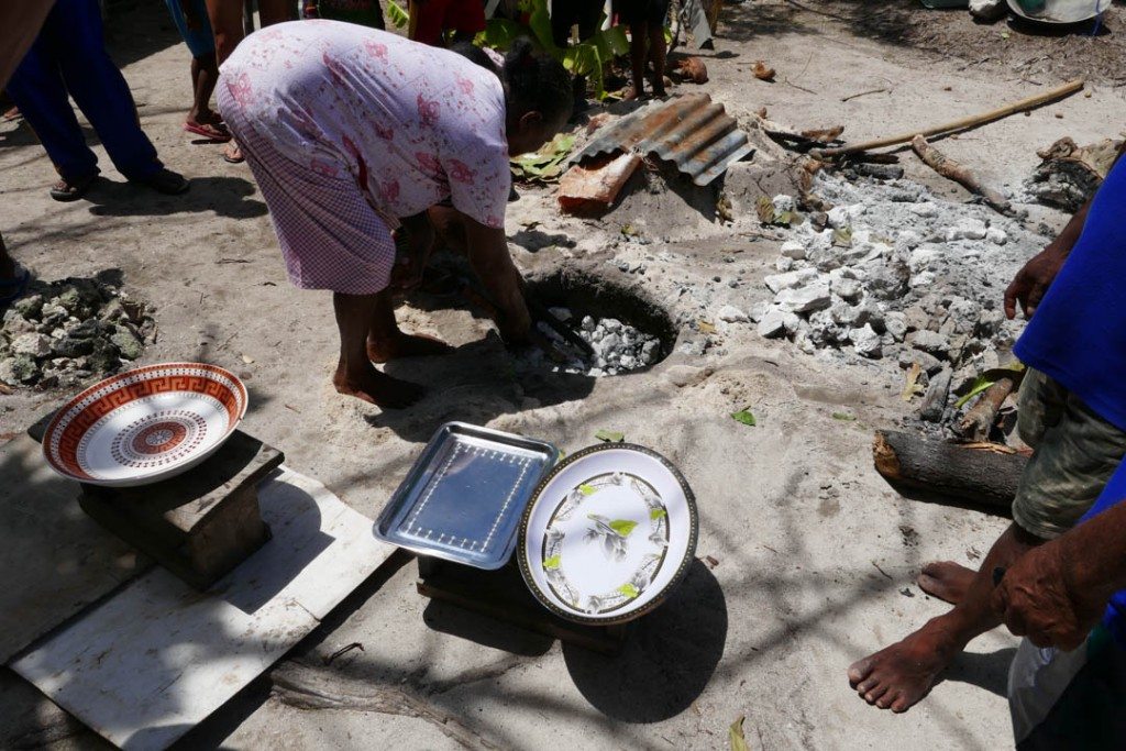 experience traditional cooking in underground ovens. Contented Traveller